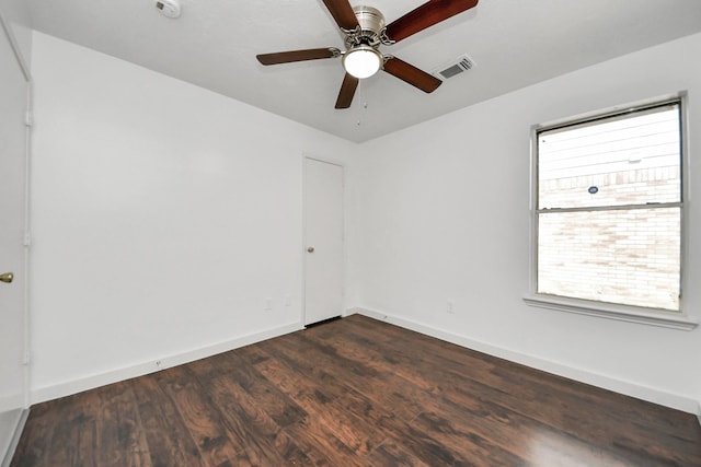 9223 Eaglewood Glen Trl, Houston, TX 77083 - empty room with dark wood-style flooring, ceiling fan, and baseboards