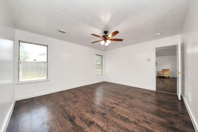 9223 Eaglewood Glen Trl, Houston, TX 77083 - unfurnished room with dark wood-type flooring, a ceiling fan, baseboards, and a textured ceiling