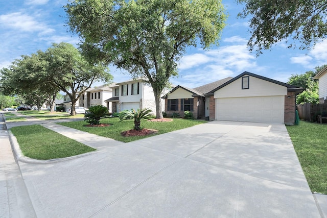 9223 Eaglewood Glen Trl, Houston, TX 77083 - view of front of property featuring brick siding, concrete driveway, and an attached garage