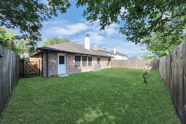 9223 Eaglewood Glen Trl, Houston, TX 77083 - back of house featuring brick siding, a chimney, a shingled roof, and central AC unit