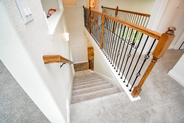 2804 Sable Creek Ln, Pearland, TX 77584 - staircase featuring carpet floors and baseboards