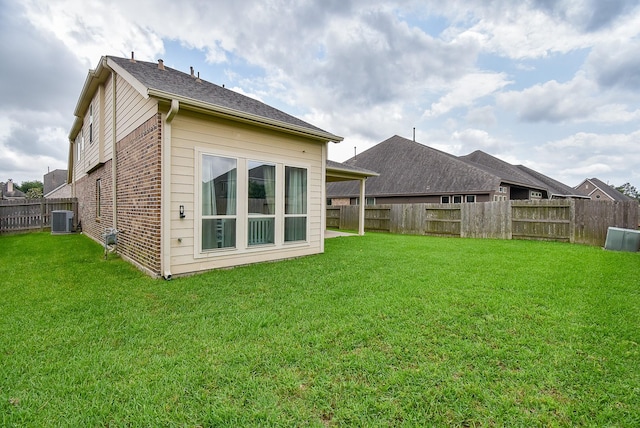 2804 Sable Creek Ln, Pearland, TX 77584 - back of property with central air condition unit and brick siding