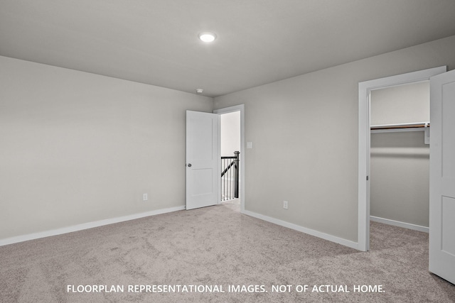 528 Flower Reed Ct, Magnolia, TX 77354 - unfurnished bedroom with carpet flooring, a spacious closet, baseboards, and a closet
