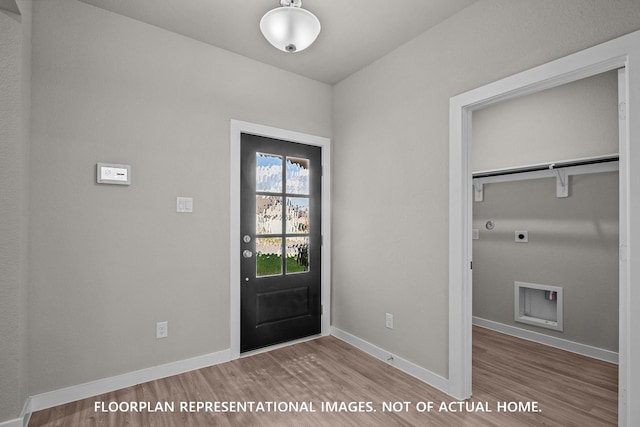 528 Flower Reed Ct, Magnolia, TX 77354 - doorway with wood finished floors and baseboards
