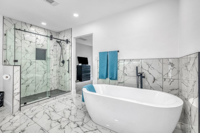1118 Cheyenne Meadows Dr, Katy, TX 77450 - full bathroom featuring a marble finish shower, recessed lighting, marble finish flooring, a soaking tub, and tile walls