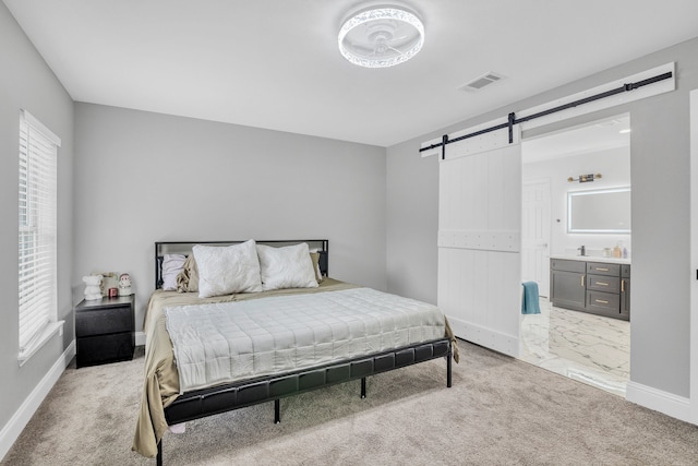 1118 Cheyenne Meadows Dr, Katy, TX 77450 - bedroom featuring a barn door, baseboards, and light colored carpet