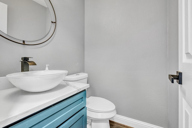 1118 Cheyenne Meadows Dr, Katy, TX 77450 - half bathroom featuring vanity, toilet, and wood finished floors