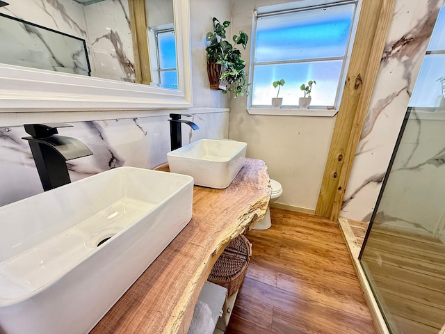 5602 Valkeith Dr, Houston, TX 77096 - bathroom featuring wood finished floors, toilet, vanity, and baseboards