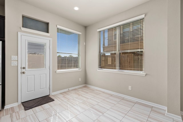 2531 Terrace Point Dr, Missouri City, TX 77459 - foyer entrance with baseboards, light tile patterned flooring, and recessed lighting