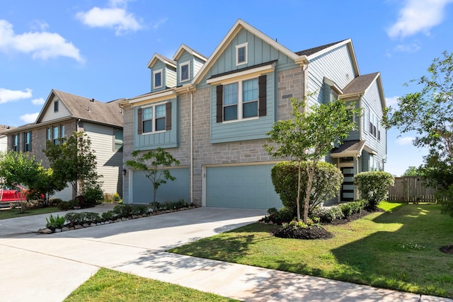 2531 Terrace Point Dr, Missouri City, TX 77459 - view of front of property featuring board and batten siding, stone siding, driveway, and an attached garage