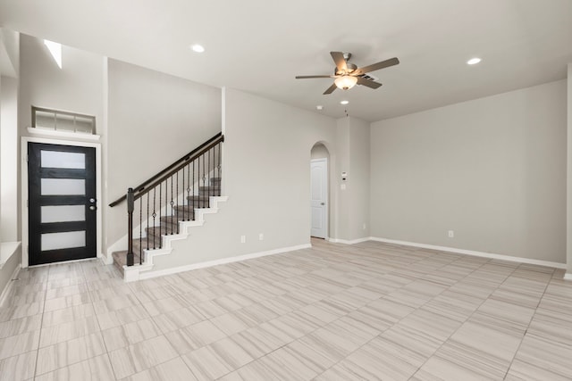 2531 Terrace Point Dr, Missouri City, TX 77459 - entryway featuring a ceiling fan, arched walkways, baseboards, recessed lighting, and stairway