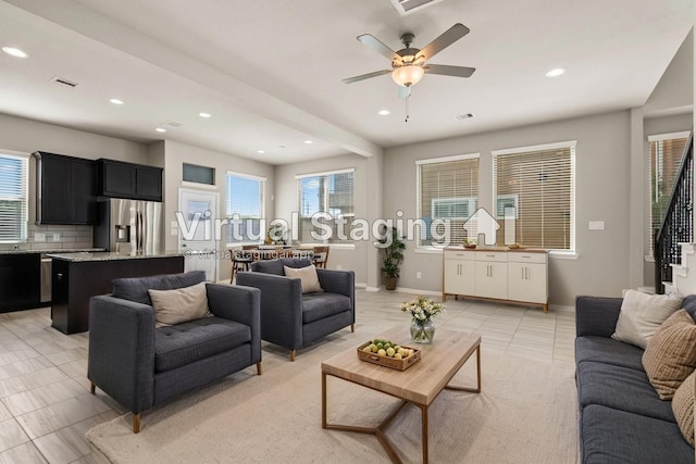 2531 Terrace Point Dr, Missouri City, TX 77459 - living area with recessed lighting, healthy amount of natural light, a ceiling fan, light tile patterned floors, and baseboards