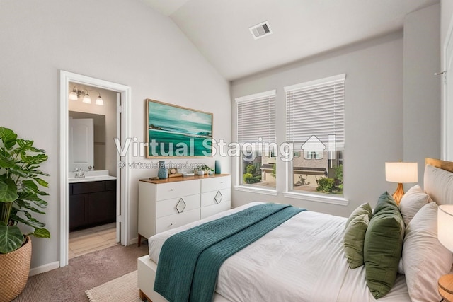 2531 Terrace Point Dr, Missouri City, TX 77459 - bedroom featuring vaulted ceiling, light colored carpet, ensuite bath, and baseboards