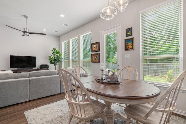 dining room with wood finished floors, ceiling fan, and recessed lighting