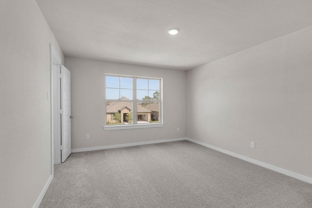 21611 Elmheart Dr, New Caney, TX 77357 - empty room with light carpet and recessed lighting
