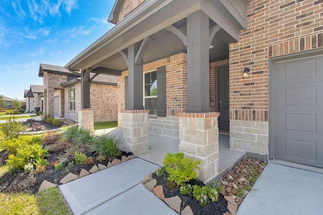 21611 Elmheart Dr, New Caney, TX 77357 - doorway to property with a porch, brick siding, and a garage