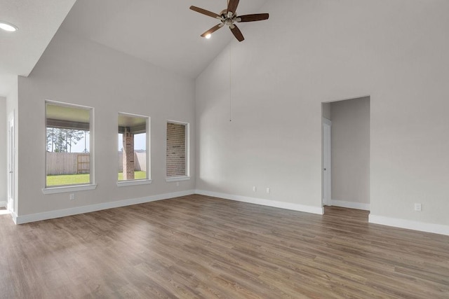 21611 Elmheart Dr, New Caney, TX 77357 - empty room featuring high vaulted ceiling, ceiling fan, wood finished floors, and recessed lighting