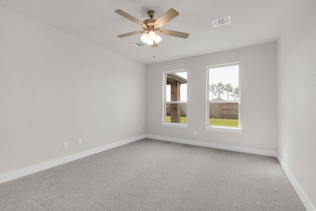 21611 Elmheart Dr, New Caney, TX 77357 - spare room with light carpet and a ceiling fan