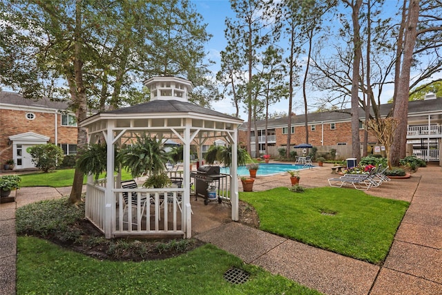 4040 San Felipe St Unit 178, Houston, TX 77027 - view of grassy yard featuring a gazebo, a community pool, and a patio area