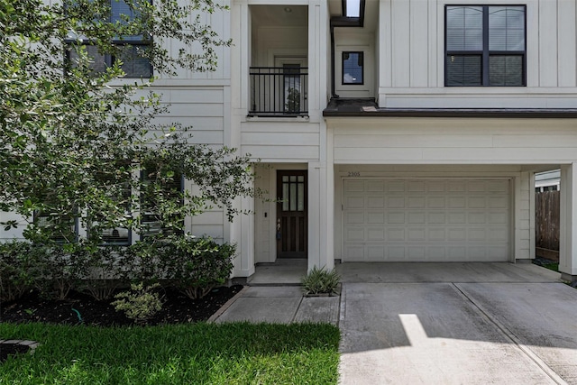 2305 Langston St, Houston, TX 77007 - view of front of property with board and batten siding, an attached garage, and concrete driveway