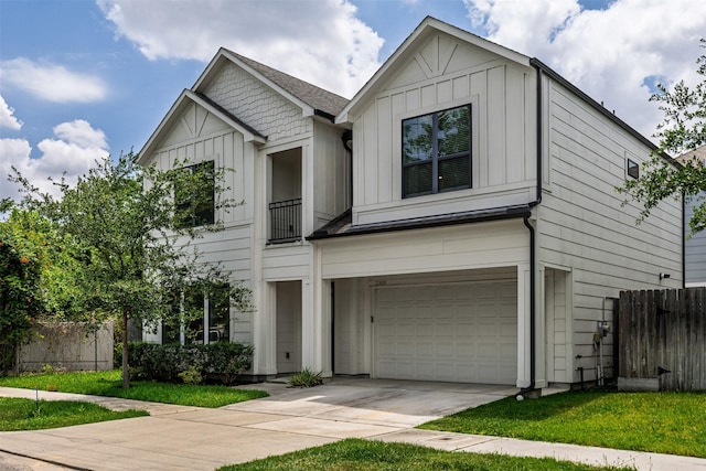 2305 Langston St, Houston, TX 77007 - view of front facade featuring board and batten siding, a garage, and concrete driveway