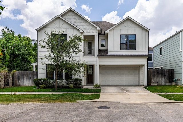 2305 Langston St, Houston, TX 77007 - view of front of home featuring board and batten siding, a garage, and driveway