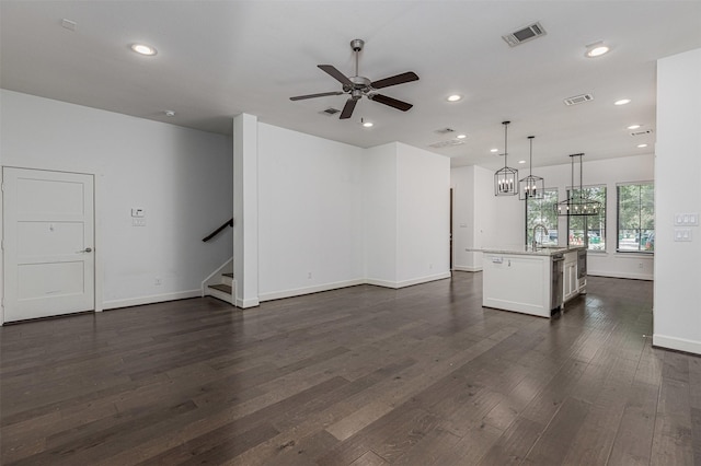 2305 Langston St, Houston, TX 77007 - unfurnished living room featuring ceiling fan, stairway, recessed lighting, dark wood-type flooring, and baseboards