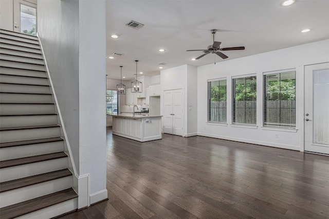 2305 Langston St, Houston, TX 77007 - unfurnished living room featuring stairs, a ceiling fan, dark wood-style flooring, recessed lighting, and baseboards