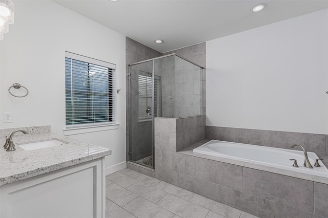 2305 Langston St, Houston, TX 77007 - bathroom with a garden tub, tile patterned flooring, a shower stall, vanity, and recessed lighting