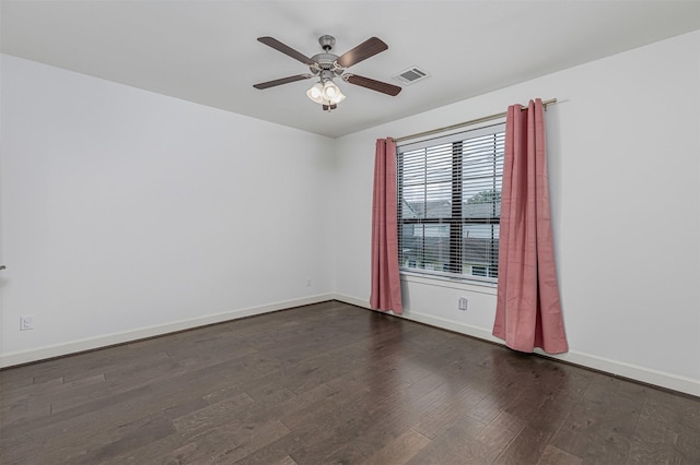 2305 Langston St, Houston, TX 77007 - unfurnished room with dark wood-type flooring, baseboards, and ceiling fan