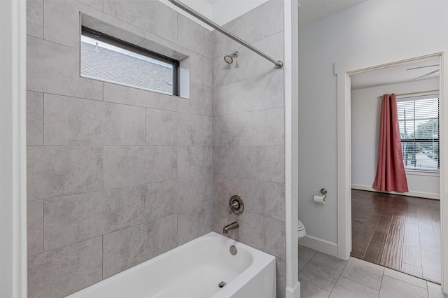 2305 Langston St, Houston, TX 77007 - full bath featuring toilet, bathing tub / shower combination, tile patterned flooring, and baseboards