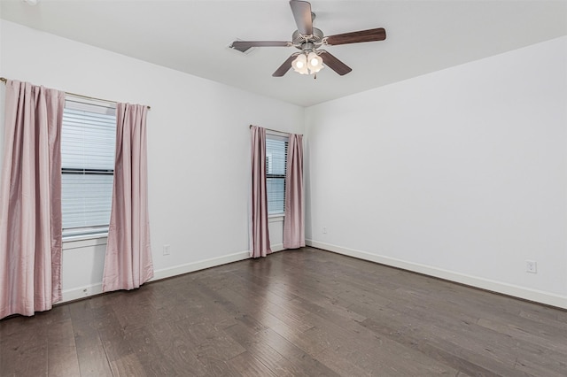 2305 Langston St, Houston, TX 77007 - empty room with dark wood finished floors, ceiling fan, baseboards, and plenty of natural light