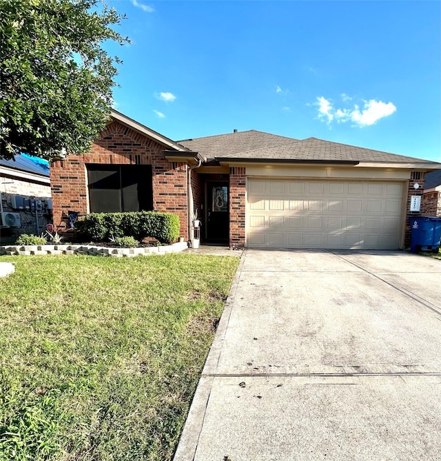 16410 Rodeo River Rd, Houston, TX 77049 - ranch-style home featuring brick siding, concrete driveway, a garage, and a front lawn