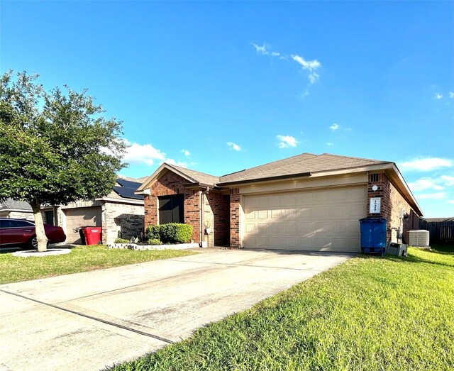 16410 Rodeo River Rd, Houston, TX 77049 - single story home featuring brick siding, an attached garage, a front lawn, and concrete driveway