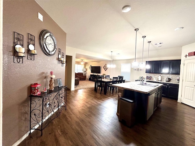 16410 Rodeo River Rd, Houston, TX 77049 - kitchen featuring dark wood-style floors, a sink, light countertops, and healthy amount of natural light