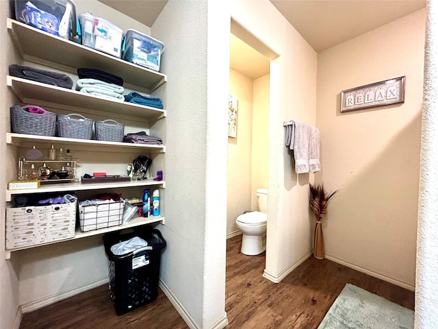 16410 Rodeo River Rd, Houston, TX 77049 - bathroom featuring wood finished floors, baseboards, and toilet