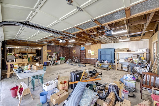 1316 Harvard St, Houston, TX 77008 - garage featuring a workshop area and a garage door opener