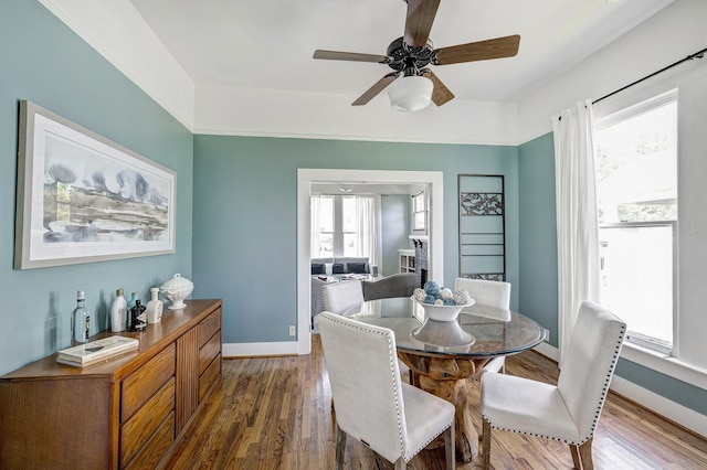 1316 Harvard St, Houston, TX 77008 - dining area with a ceiling fan, dark wood-style floors, and baseboards