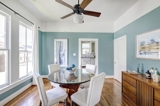 1316 Harvard St, Houston, TX 77008 - dining area with healthy amount of natural light, wood finished floors, a ceiling fan, and baseboards