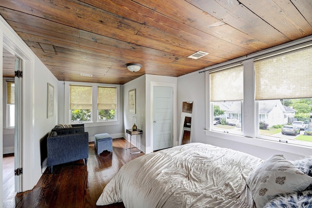 1316 Harvard St, Houston, TX 77008 - bedroom with wooden ceiling, multiple windows, hardwood / wood-style flooring, and baseboards