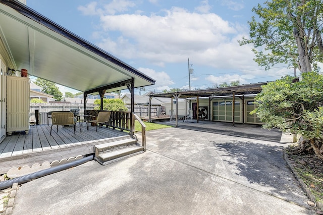 1316 Harvard St, Houston, TX 77008 - view of patio / terrace featuring a wooden deck, fence, and a carport