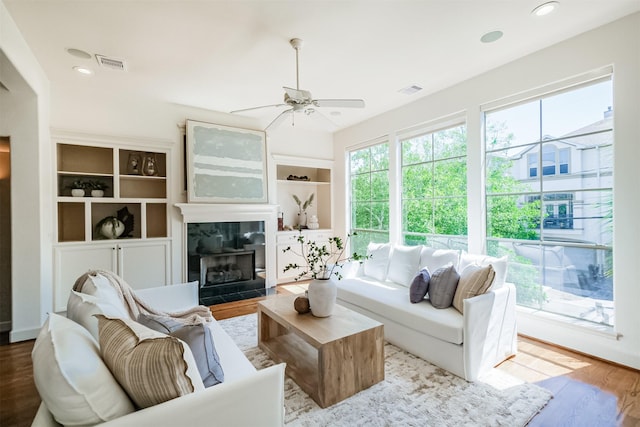 701 Asbury St, Houston, TX 77007 - living room featuring ceiling fan, wood finished floors, a fireplace, and recessed lighting