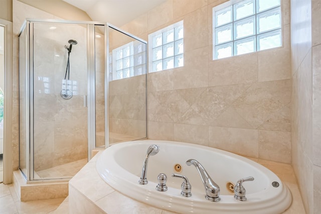 701 Asbury St, Houston, TX 77007 - bathroom with a shower stall, a tub with jets, and tile patterned flooring