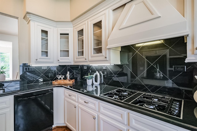 701 Asbury St, Houston, TX 77007 - kitchen with black appliances, premium range hood, dark countertops, and white cabinets