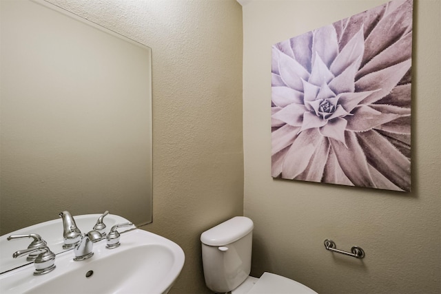 701 Asbury St, Houston, TX 77007 - bathroom featuring toilet and a sink