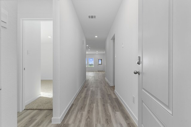 417 Amy St, Angleton, TX 77515 - hall with wood finished floors, recessed lighting, and baseboards