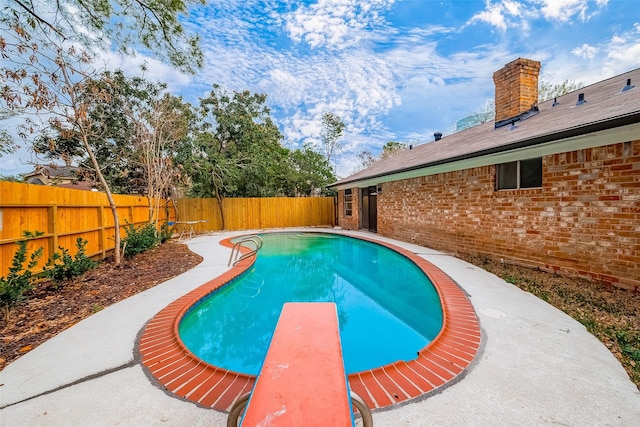 10806 Silkwood Dr, Houston, TX 77031 - view of pool featuring a fenced backyard and a diving board