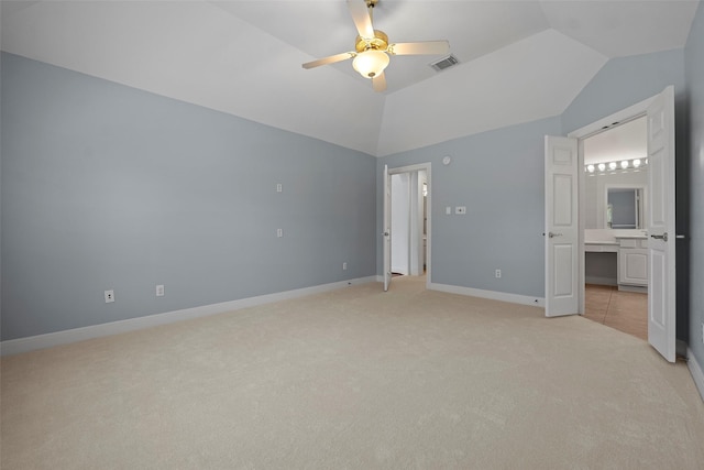 16503 Torry View Ter, Houston, TX 77095 - unfurnished bedroom featuring light carpet, vaulted ceiling, baseboards, connected bathroom, and a ceiling fan