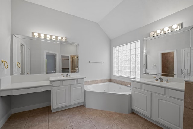 16503 Torry View Ter, Houston, TX 77095 - full bathroom with vaulted ceiling, a whirlpool tub, two vanities, and tile patterned floors