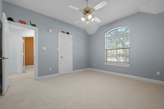 16503 Torry View Ter, Houston, TX 77095 - spare room with light carpet, vaulted ceiling, a ceiling fan, and baseboards